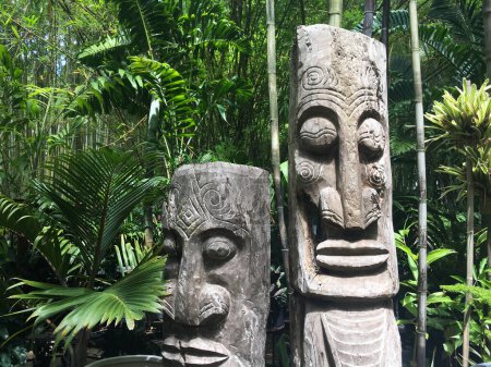 Photo for An old pacific islands wood curving totem sculptures in rain forest. - Royalty Free Image