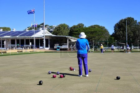 Photo for COOLUM BEACH, QLD - APR 13 2023:Active seniors Australian people play bowls. It found that the sport improves person's mental awareness, concentration, strategic thinking, motor skills and balance. - Royalty Free Image