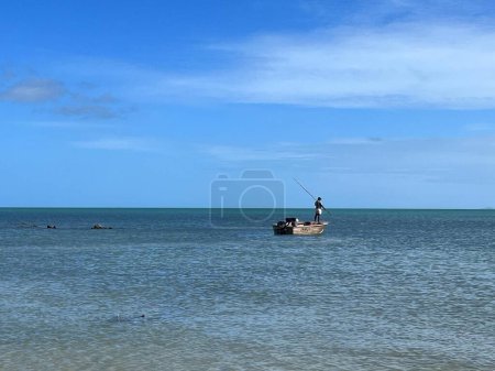 Photo for Torres Strait Islander fisherman fishing Coral sea in Cape York Queensland, Australia - Royalty Free Image