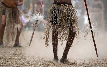 Photo for LAURA,QLD - JULY 08 2023:Indigenous Australian men holding traditional weapons during a ceremonial dance in Laura Quinkan Dance Festival Cape York Australia. Ceremonies combine dance, song, rituals, body decorations and costumes - Royalty Free Image