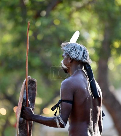 Photo for LAURA,QLD - JULY 08 2023:Indigenous Australian man holding traditional weapons during a ceremonial dance in Laura Quinkan Dance Festival Cape York Australia. Ceremonies combine dance, song, rituals, body decorations and costumes - Royalty Free Image