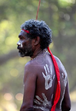 Photo for LAURA,QLD - JULY 08 2023:Indigenous Australian man holding traditional weapons during a ceremonial dance in Laura Quinkan Dance Festival Cape York Australia. Ceremonies combine dance, song, rituals, body decorations and costumes - Royalty Free Image