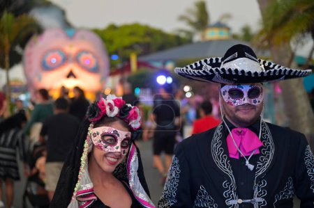 Photo for GOLD COAST - FEB 17 2024:People dressed as Mexican couple celebrate Day of the Dead holiday. It is widely observed in Mexico, where it largely developed, and is also observed in other places, especially by people of Mexican heritage - Royalty Free Image