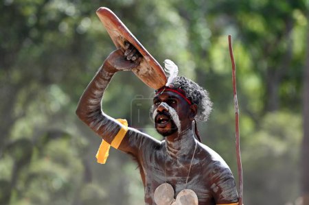 Photo for LAURA,QLD - JULY 08 2023:Indigenous Australian man holding weapons on ceremonial dance in Laura Festival Cape York Australia.Ceremonies combine dance, song, rituals, body decoration and costumes. - Royalty Free Image