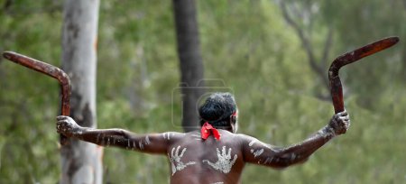 Photo for LAURA,QLD - JULY 08 2023:Indigenous Australians man holding boomerang on ceremonial dance in Laura Festival Cape York Australia. Ceremonies combine dance, song, rituals, body decorations and costume. - Royalty Free Image