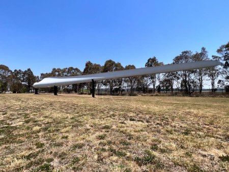 Photo for GLEN INNES, NSW - OCT 31 2023:White Rock Wind Farms mighty turbine blade monument.Glen Innes in New South Wales Australia is home to the largest windfarm in the southern hemisphere - Royalty Free Image