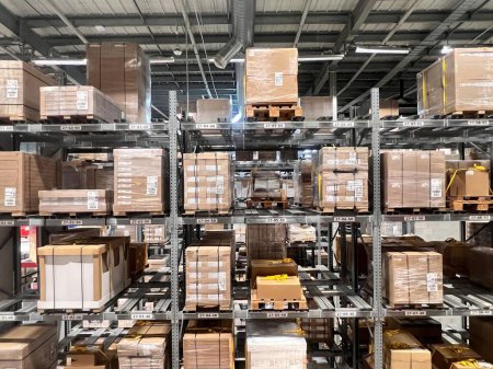 Photo for Many boxes packages inside a large warehouse space. - Royalty Free Image