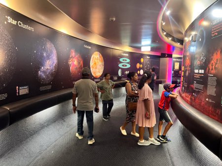 Photo for BRISBANE - DEC 12 2023:Visitors at Sir Thomas Brisbane Planetarium, that runs more than 1,300 regular shows per year in the Cosmic Skydome for public and school groups in the observatory. - Royalty Free Image