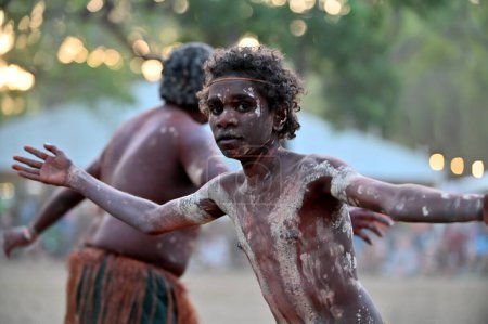 LAURA,QLD - JULY 08 2023:Indigenous Australians men on ceremonial dance in Laura Quinkan Dance Festival Cape York Australia. Ceremonies combine dance, song, rituals, body decorations and costumes