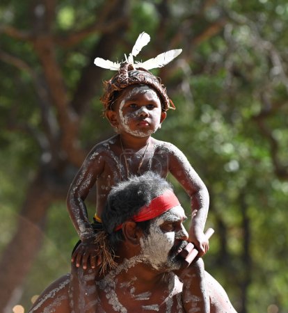 Photo for LAURA,QLD - JULY 08 2023:Indigenous Australians father and son on  in Laura Quinkan Dance Festival Cape York Australia. Ceremonies combine dance, song, rituals, body decorations and costumes - Royalty Free Image