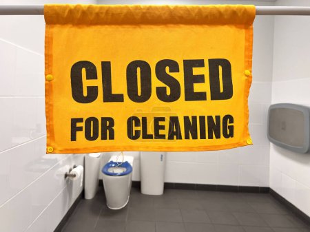 Photo for Temporary closed for cleaning sign in public toilet during during hygiene cleaning - Royalty Free Image