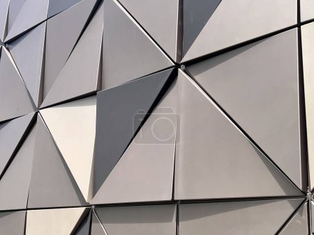 Photo for Geometrical triangular shape on metal building wall abstract background and texture. - Royalty Free Image