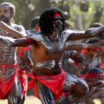 LAURA,QLD - JULY 08 2023:Indigenous Australians men on ceremonial dance in Laura Quinkan Dance Festival Cape York Australia. Ceremonies combine dance, song, rituals, body decorations and costumes