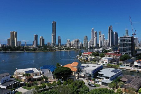 Photo for Aerial drone landscape view of luxury house against Surfers Paradise city skyline in Gold Coast Queensland, Australia - Royalty Free Image