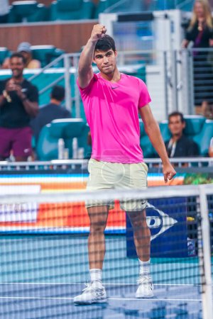 Photo for MIAMI GARDENS, FLORIDA - MARCH 29, 2023: Carlos Alcaraz of Spain celebrates victory after quarter-final match against Taylor Fritz of USA at 2023 Miami Open at the Hard Rock Stadium in Miami Gardens, Florida, USA - Royalty Free Image