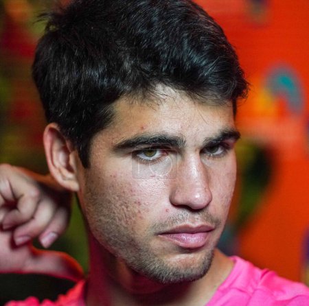 Photo for MIAMI GARDENS, FLORIDA - MARCH 30, 2023: Carlos Alcaraz of Spain during TV interview after quarter-final match against Taylor Fritz of United States at 2023 Miami Open at the Hard Rock Stadium in Miami Gardens, Florida, USA - Royalty Free Image