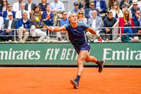 Photo for PARIS, FRANCE - MAY 30, 2022: Professional tennis player Holger Rune of Denmark in action during his round 4 match against Stefanos Tsitsipas of Greece at 2022 Roland Garros in Paris, France - Royalty Free Image