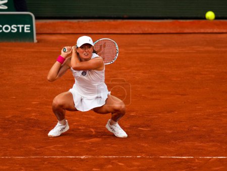 Photo for PARIS, FRANCE - JUNE 8, 2023: Professional tennis player Iga Swiatek of Poland in action during women singles semi-final match against Beatriz Haddad Maia of Brazil at 2023 Roland Garros in Paris, France - Royalty Free Image