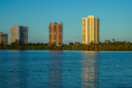 Photo for RIVIERA BEACH, FLORIDA - NOVEMBER 15, 2022: Luxury condominiums at Singer Island, Florida (view from Intracoastal). Singer Island an oceanfront neighborhood part of the city of Riviera Beach with natural beaches and upscale hotels - Royalty Free Image