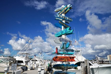 Photo for PALM BEACH SHORES, FLORIDA - NOVEMBER 8, 2023: Signpost at The Sailfish Marina Resort in Palm Beach Shores, Florida. Home to a world-famous fleet of luxury sport fishing yachts Sailfish Marina Resort is a favorite docking in the Palm Beaches - Royalty Free Image
