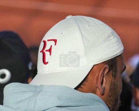 Photo for PARIS, FRANCE - MAY 30, 2023: Tennis fan wears Roger Federer hat during men's first round match between Holger Rune and Christopher Eubanks during 2023 Roland Garros in Paris, France - Royalty Free Image