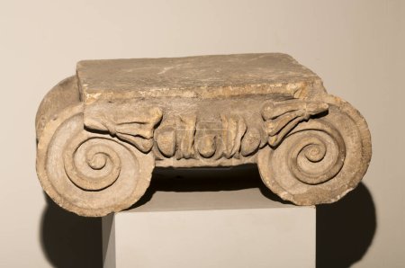 Photo for Part of an ancient Roman column. Ionic order. Capital (composed of abacus and volutes). - Royalty Free Image