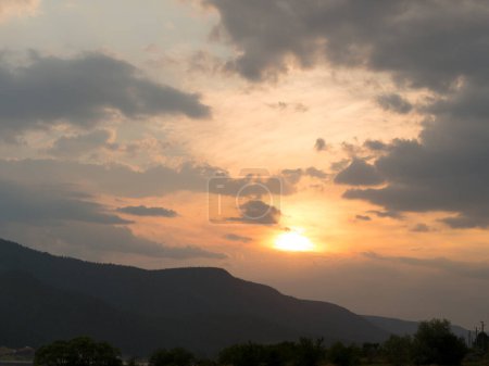 Sunset over the town of Sarnitsa, located in the Western Rhodope Mountains near the Dospat Reservoir.