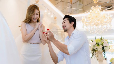 Photo for Will You Marry Me Concept. young girl happy and surprise. man making a proposal while giving an engagement ring for his lovely girl - Royalty Free Image