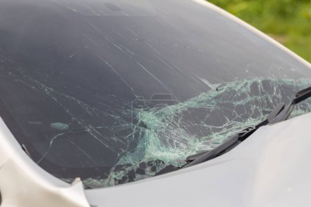 Photo for Broken car windshield .Crash windshield glass the broken and damaged car. Tempered glass shattered in an accident. Broken Windshield - Royalty Free Image