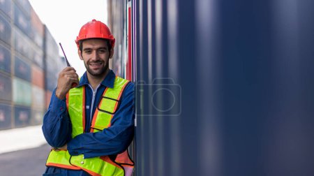 Photo for Foreman man working checking at Container cargo harbor to loading containers. Professional foreman work at Container cargo site check up goods in container. Workers are opening containers for check. - Royalty Free Image