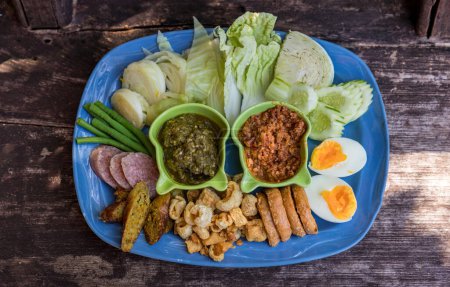 Photo for Tradition Northern Thai food. Northern Thai Green Chilli Dip thai name is "Nam Prik Num". Local food in thailand. deep fried pork skin. - Royalty Free Image