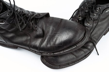 Photo for A pair of worn men's leather boots isolated on a white background - Royalty Free Image