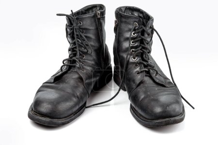 Photo for A pair of worn men's leather boots Isolated on a white background. - Royalty Free Image