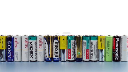 Photo for Kyiv, Ukraine - May 20, 2023: Many used and damaged primary and  secondary batteries from different manufacturers stand in a row - Royalty Free Image