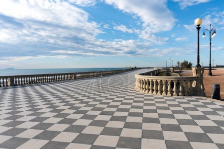 Foto de Livorno,Italy-november  27, 2022:view of the Mascagni terrace, a splendid belvedere terrace with checkerboard paved surface, Livorno, Tuscany, Italy during a sunny day. - Imagen libre de derechos
