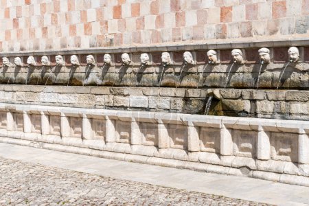 Photo for L'Aquila, Italy-august 11, 2021:Particular of the Fountain of 99 Spouts during a sunny day - Royalty Free Image