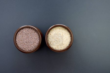 Psyllium seeds and husks in round brown bowls on a gray background.