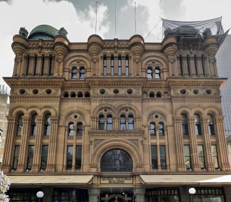 Photo for The Heritage-listed Queen Victoria Building finished in 1898 in Romanesque Revival style, facade facing Druitt Street with cantilevered awnings-sandstone walls-copper domes. Sydney CBD-NSW-Australia. - Royalty Free Image