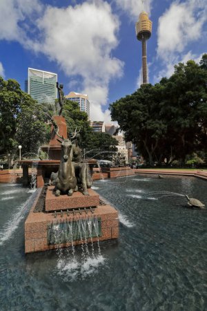 Photo for J.F.Archibald Memorial Fountain in Hyde Park by Francois-Leon Sicard placed in 1932 depicting Apollo on top and Diana with hunter Actaeon as a deer at foot. Tower Eye background. Sydney-NSW-Australia. - Royalty Free Image