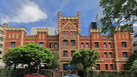Photo for Former Salvation Army Training College built in AD 1901 on Victoria Parade in Gothic Tudor style of red brickwork facade, cement render quoining and tower with corner turrets. Melbourne-VIC-Australia. - Royalty Free Image