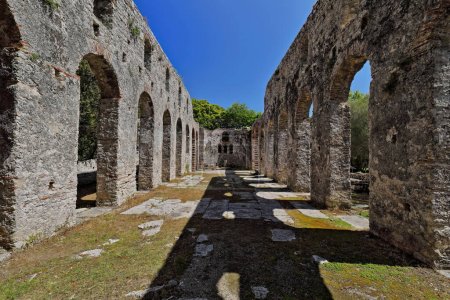 Photo for Brickwork-made round arches making up the central aisle south and north walls, great basilica from the 5th century AD end-6th century AD beginning, Butrint archaeological site. Vlore county-Albania. - Royalty Free Image