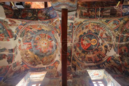 Photo for Ceiling frescoes, Saint Mary's Church of Leusa built in the 18th century on the remains of a Byzantine-era older one featuring highly vandalized murals from 1812 depicting Bible scenes. Permet-Albania - Royalty Free Image