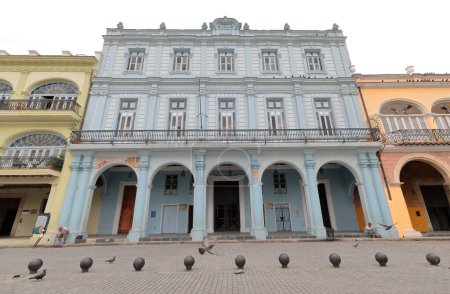 Photo for Buildings along San Ignacio Street facing east as it crosses the AD 1559 founded Plaza Vieja -Old Square- west side: Casa del Conde de Canongo House built in AD 1816, rebuilt in 1912. Old Havana-Cuba. - Royalty Free Image