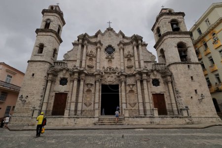 Photo for Front view from the square of the southeast-facing, coral stone concave facade, AD 1748-1777 built Baroque Catedral de San Cristobal Cathedral Church, designed by Francesco Borromini. Old Havana-Cuba. - Royalty Free Image