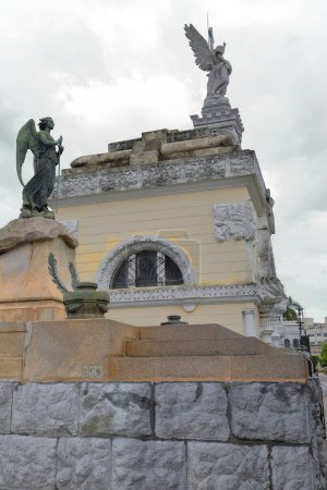 Row of three monuments in increasing scale on Avenida Colon Avenue west side, Cementerio de Colon Cemetery featuring elaborately sculpted memorials estimated to be 500 plus mausoleums. Havana-Cuba.