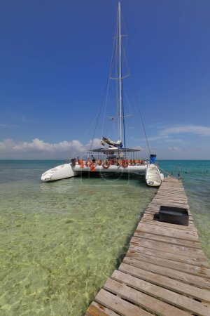 The pier made of wooden planks nailed together serving as mooring point for the tourist cruising catamaran sailing from the main island to Cayo Iguana or Macho de Afuera Key and back. Trinidad-Cuba.