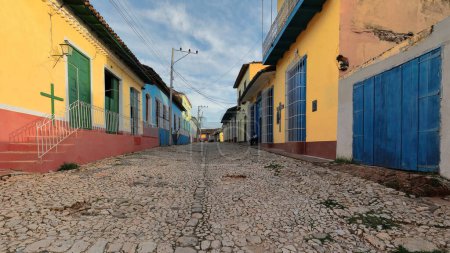 Photo for Colorist colonial houses on both sides of the cobbled sloping Calle Amargura Street, up to the junction with Calle Desengano Street. Trinidad-Cuba-271 - Royalty Free Image