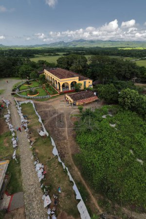 Photo for Trinidad, Cuba-October 14, 2019: ''Table Linen Avenue'' leading to the owner's house in the Manaca Iznaga Estate, westward view from the 43'5 m high, 1815-1830 built tower for surveilling the slaves. - Royalty Free Image