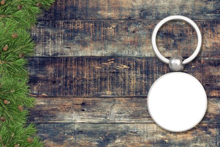 Key chain mock up with Christmas decoration. Keychain mockup on dark wooden background