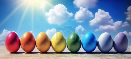 Téléchargez les photos : Œufs de Pâques colorés sur fond bleu ciel. En-tête de Pâques concept - en image libre de droit